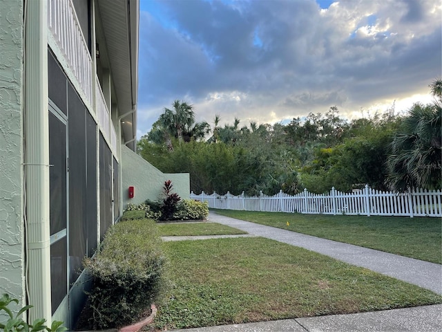 view of yard at dusk