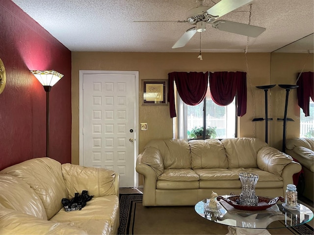 20857 Haulover Cv Unit B-13, Lutz, FL 33558 - living room featuring a textured ceiling and a ceiling fan