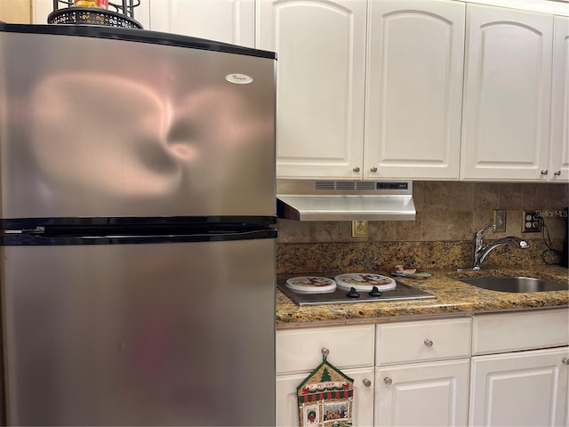 kitchen featuring appliances with stainless steel finishes and white cabinets