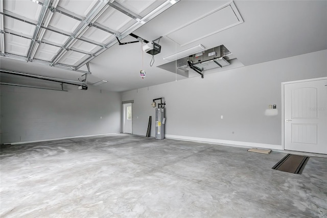 garage featuring electric water heater and a garage door opener