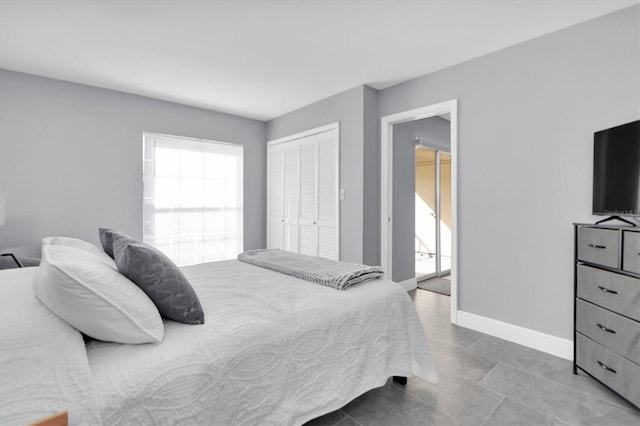 tiled bedroom with a closet