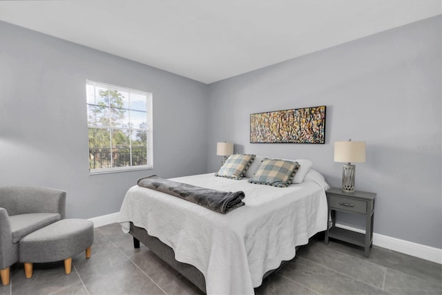 bedroom featuring dark tile patterned flooring