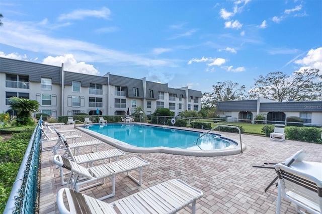 view of swimming pool with a patio