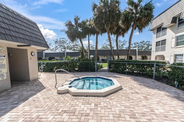 view of pool with a patio area and a community hot tub