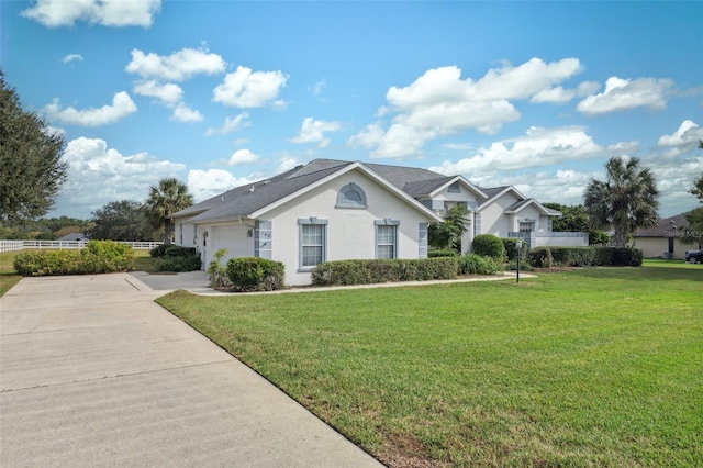 single story home featuring a front yard