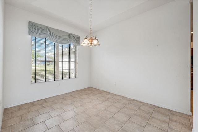 empty room with a notable chandelier and light tile patterned floors