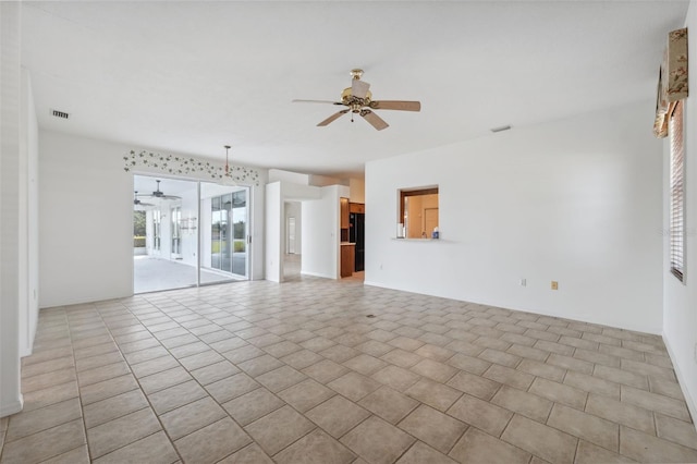 spare room with ceiling fan