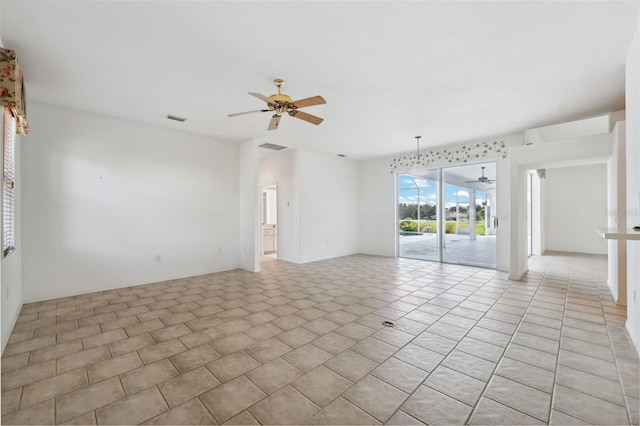 tiled empty room with ceiling fan