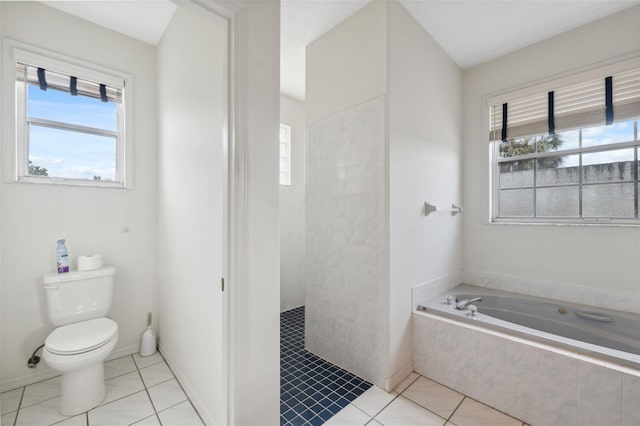 bathroom with toilet, shower with separate bathtub, a wealth of natural light, and tile patterned floors