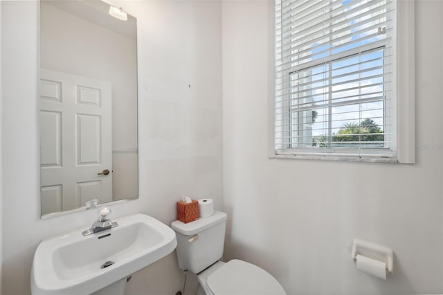 bathroom featuring toilet and sink