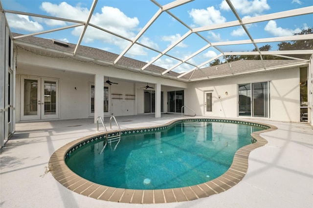 view of swimming pool featuring a patio, a lanai, and ceiling fan