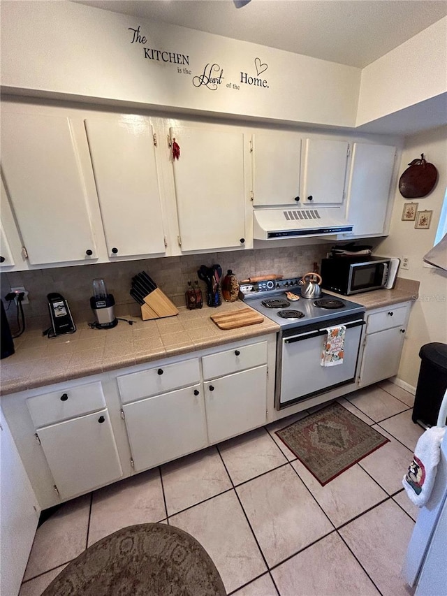 kitchen featuring white cabinetry, electric range oven, tasteful backsplash, and range hood