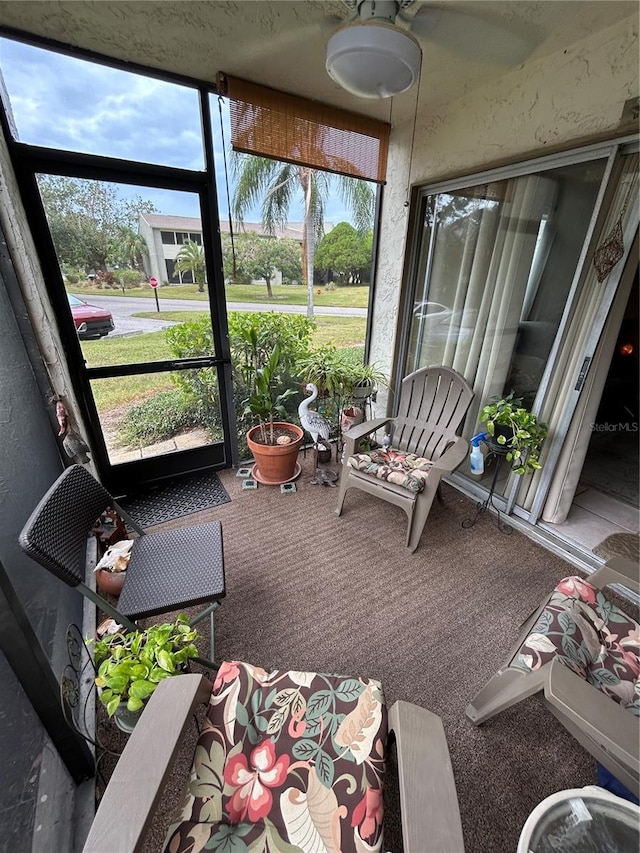 sunroom / solarium with ceiling fan