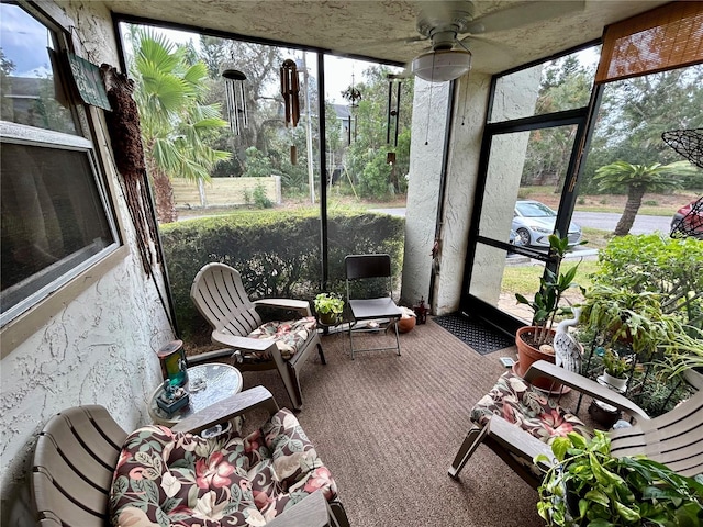 sunroom / solarium with ceiling fan and plenty of natural light