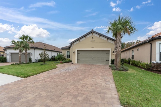 view of front of house featuring a garage and a front yard