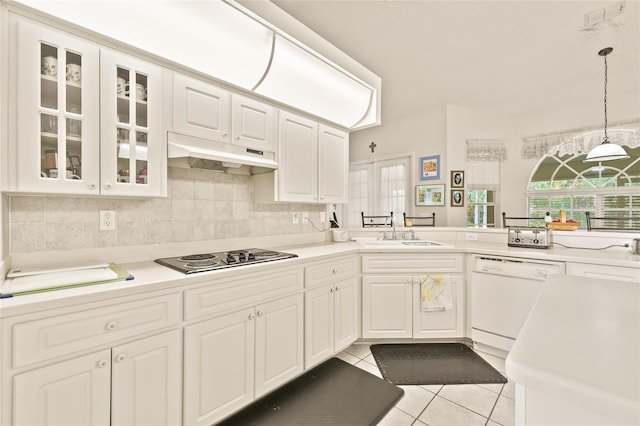 kitchen with white cabinets, dishwasher, light tile patterned floors, and stainless steel gas cooktop