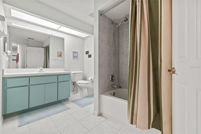 full bathroom featuring tile patterned flooring, shower / bath combination with curtain, vanity, and toilet