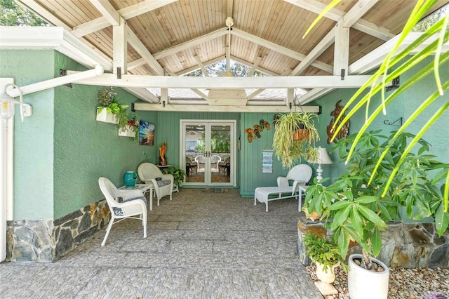 unfurnished sunroom with plenty of natural light and vaulted ceiling