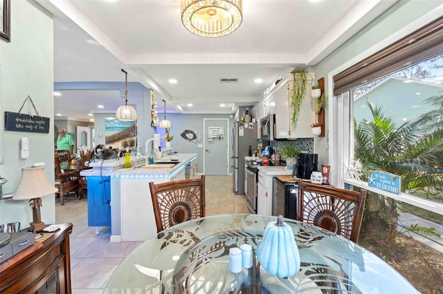 dining room with a wealth of natural light and sink