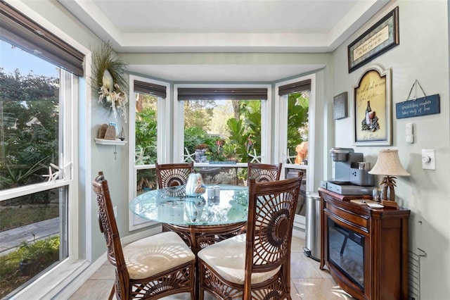 sunroom / solarium featuring a healthy amount of sunlight