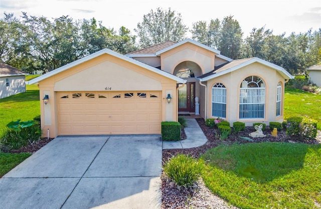 ranch-style house with a garage and a front yard