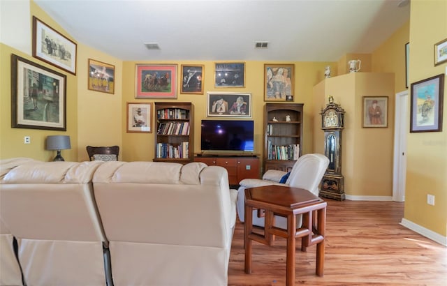 living room with light hardwood / wood-style flooring