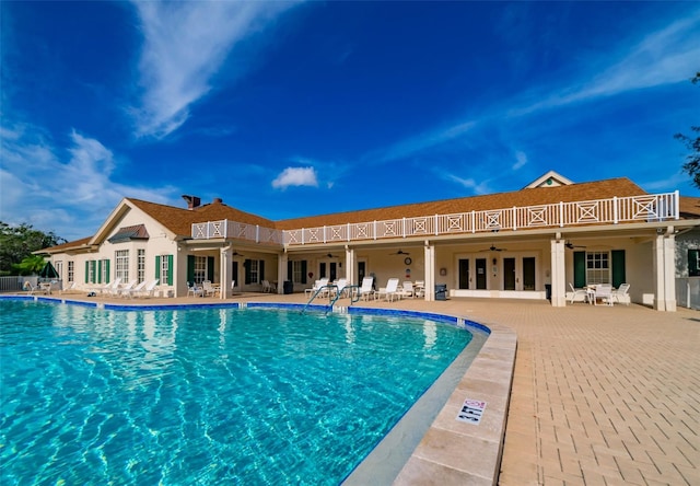 view of pool featuring french doors and a patio