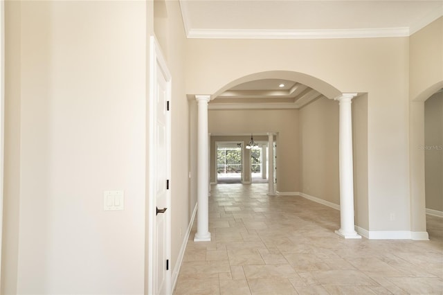 hall featuring ornate columns and crown molding