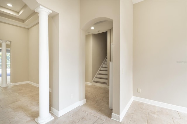 corridor featuring decorative columns