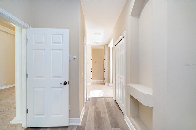 hall with light wood-type flooring