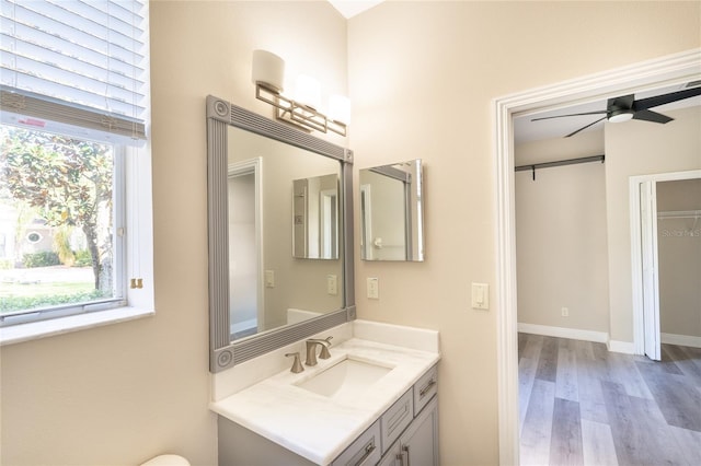 bathroom featuring vanity, hardwood / wood-style floors, and ceiling fan