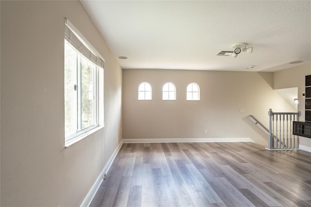 spare room featuring hardwood / wood-style flooring