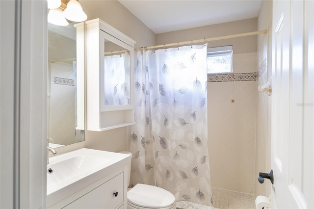 bathroom featuring vanity, toilet, and a shower with curtain