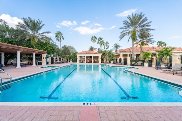 view of pool featuring a patio and a gazebo