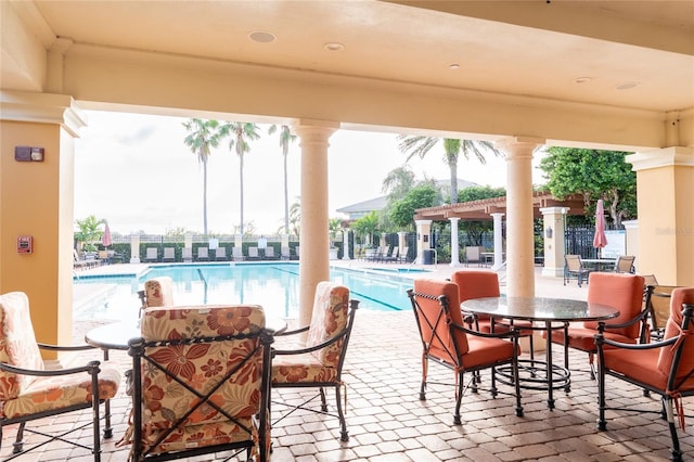 view of patio / terrace featuring a community pool