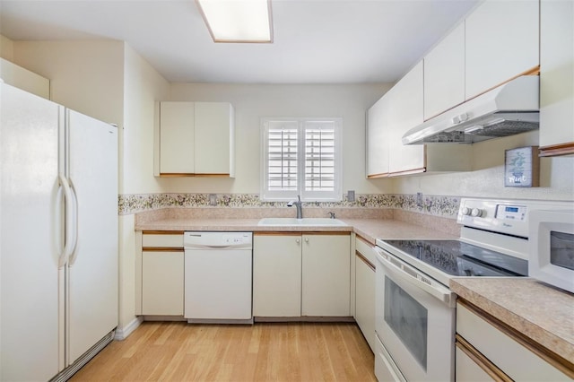 kitchen featuring ventilation hood, white appliances, sink, and light wood-type flooring