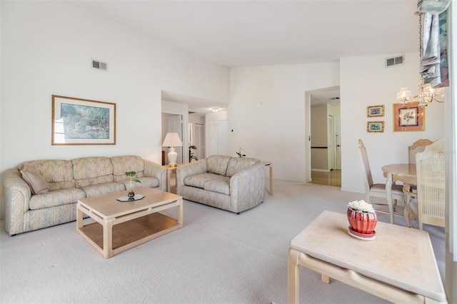 carpeted living room featuring lofted ceiling