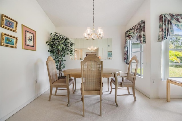 4222 Northampton Dr, New Port Richey, FL 34653 - dining area featuring light carpet, a chandelier, and baseboards