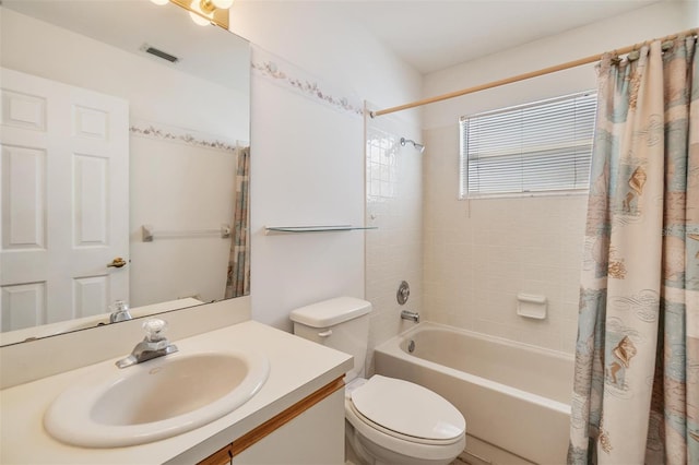 full bathroom with shower / bath combo with shower curtain, vanity, and toilet