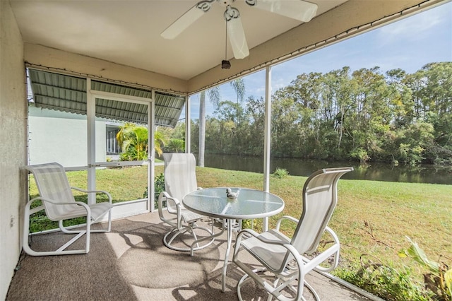 4222 Northampton Dr, New Port Richey, FL 34653 - sunroom / solarium featuring a water view, a ceiling fan, and view of scattered trees