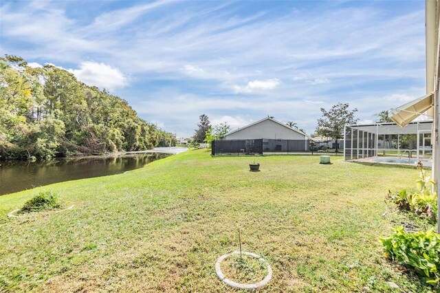 4222 Northampton Dr, New Port Richey, FL 34653 - view of grassy yard featuring a water view