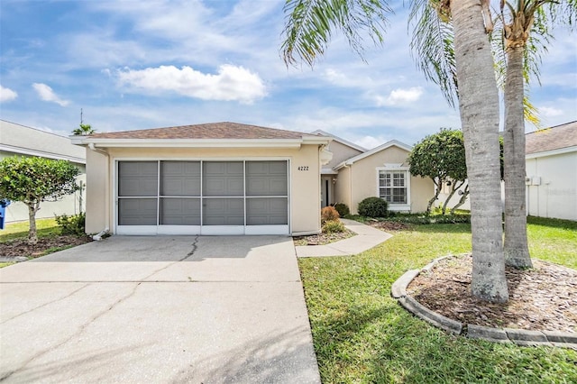 4222 Northampton Dr, New Port Richey, FL 34653 - ranch-style home with stucco siding, concrete driveway, a front lawn, and an attached garage
