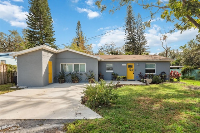 ranch-style house with a front yard