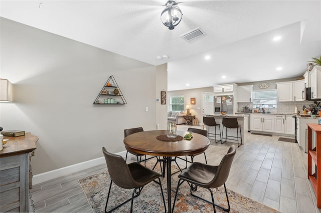 dining space featuring light hardwood / wood-style floors