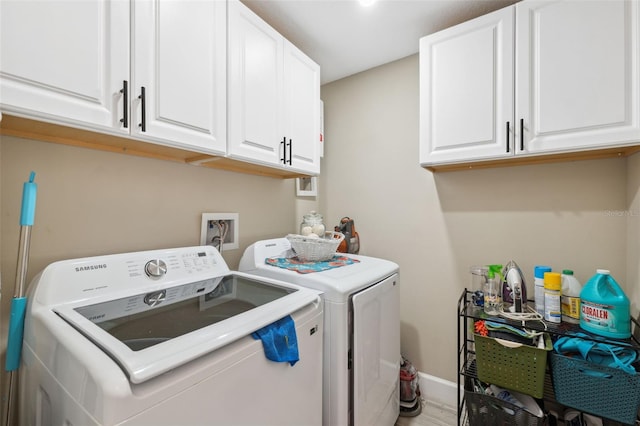 laundry room featuring cabinets and independent washer and dryer