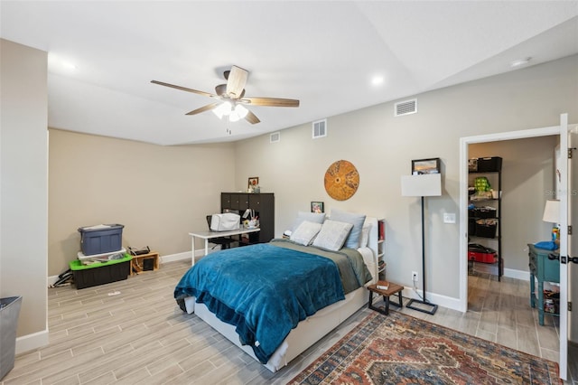 bedroom featuring light hardwood / wood-style floors and ceiling fan