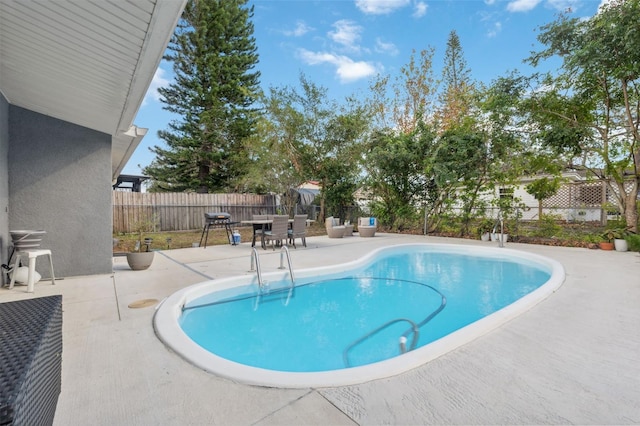 view of pool featuring a patio area