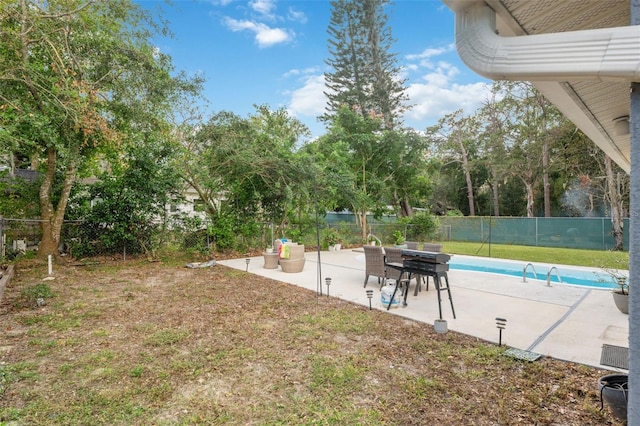 view of yard featuring a fenced in pool and a patio area