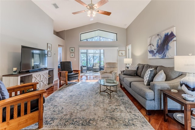 living room with ceiling fan, high vaulted ceiling, and dark hardwood / wood-style flooring