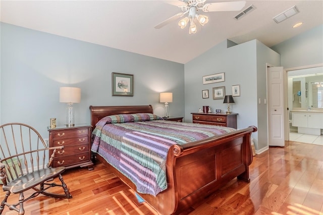 bedroom with vaulted ceiling, ceiling fan, and light hardwood / wood-style flooring